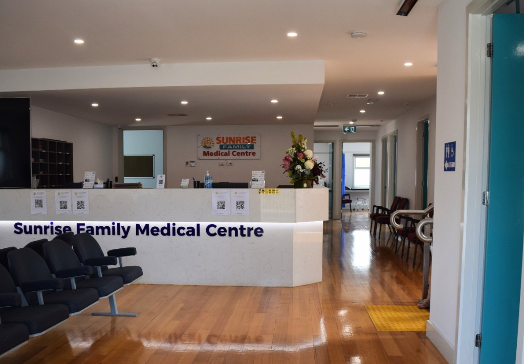 Reception desk and waiting chairs at Sunrise Family Medical Centre