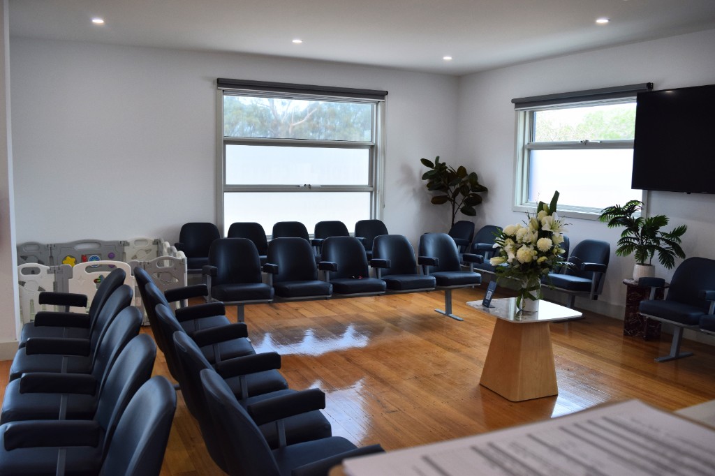 Waiting room with floral arrangement at Sunrise Family Medical Centre